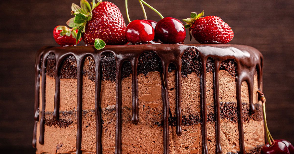 chocolate layer cake covered in fruit